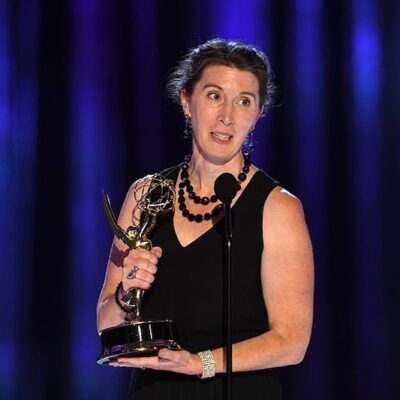 Photo of Alana Billingsley accepting an Emmy Award.