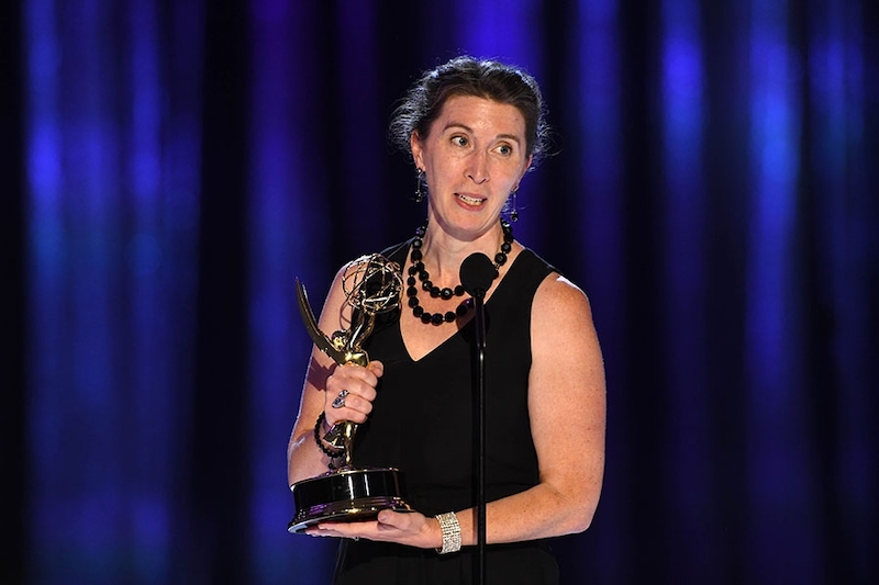 Photo of Alana Billingsley accepting an Emmy Award.