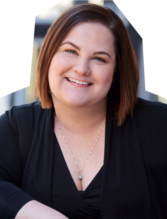 Photo fo Catie Brown, a white woman with short dark brown hair, wearing a black shirt.