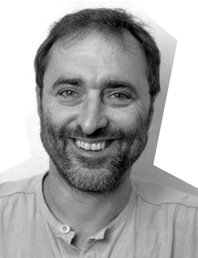 Black and white image of Ben Carter, a white man with brown hair, smiling.