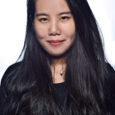 Photo of Chen-Wei Liao, a woman with long black hair wearing a black shirt.