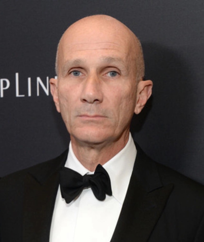 Photo of Daniel Orlandi, a white man with a bald head wearing a tuxedo and bowtie.