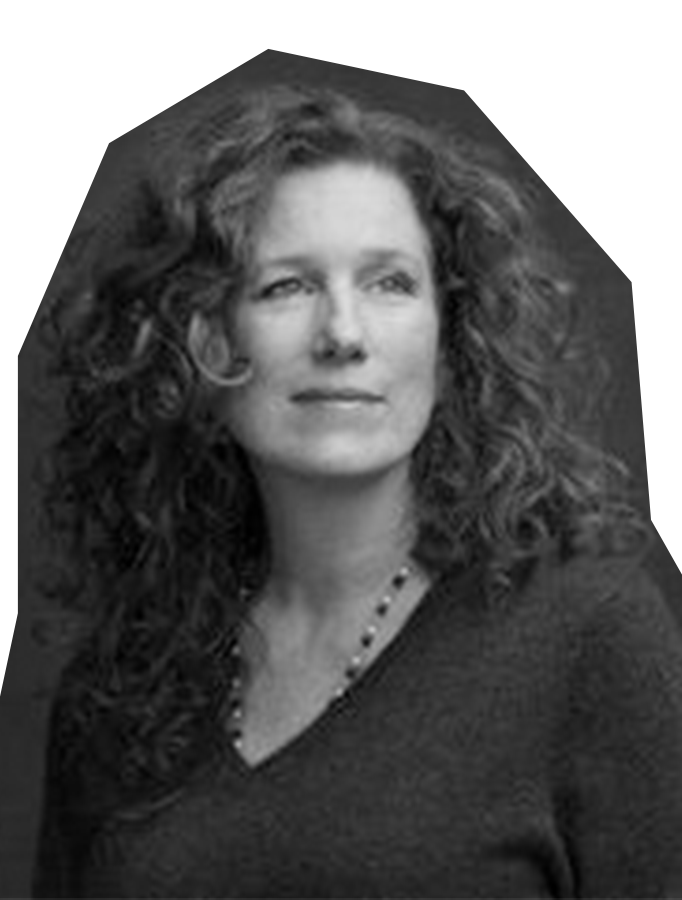 Black and white photo of Mindy Eshelman, a white woman with long, curly hair