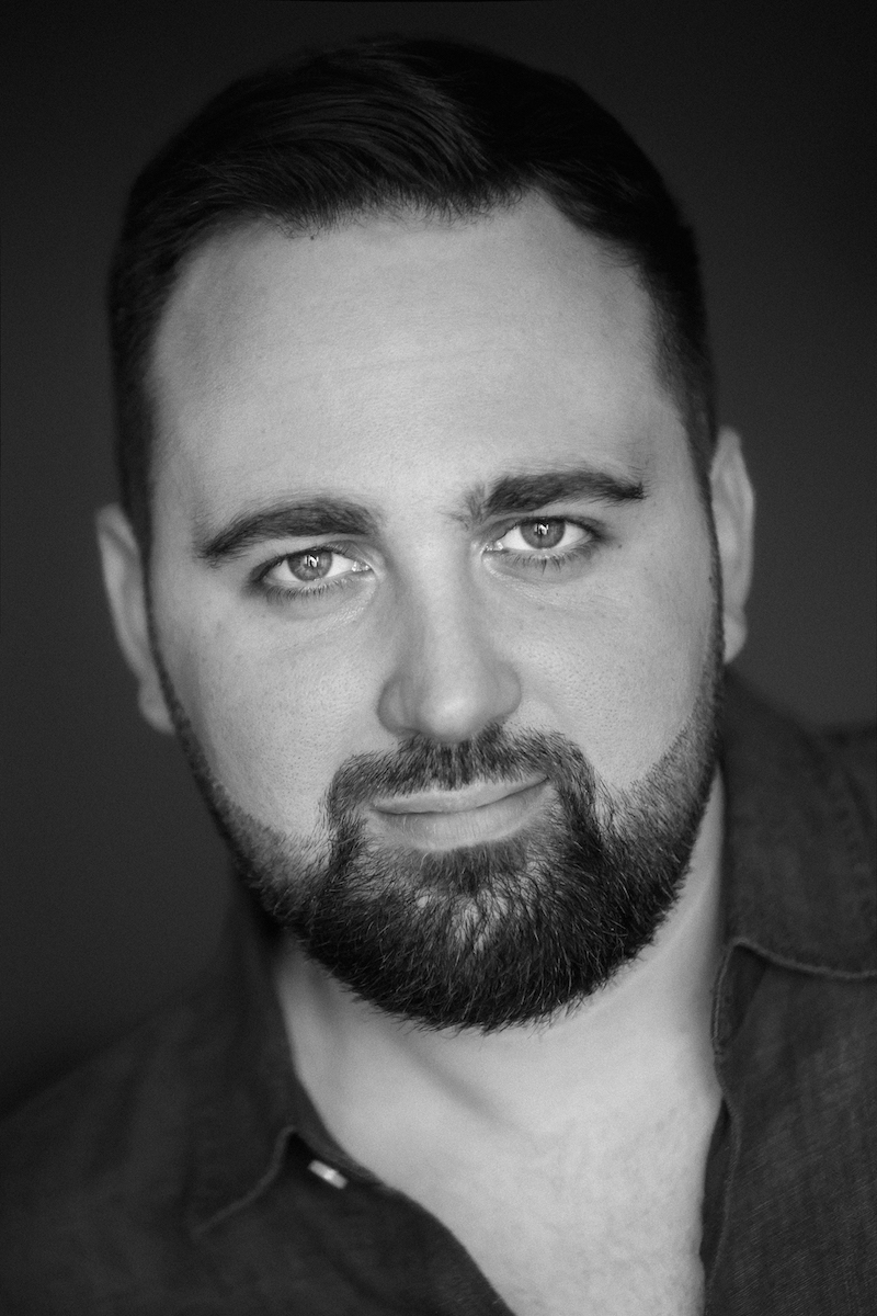 Black and white photo of Carlos Martinez, a man with dark hair and facial hair.