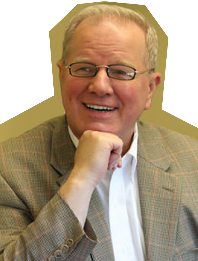 Photo of Gary Kline, a white man with white hair and glasses, wearing a tan suit and holding his hand under his chin.