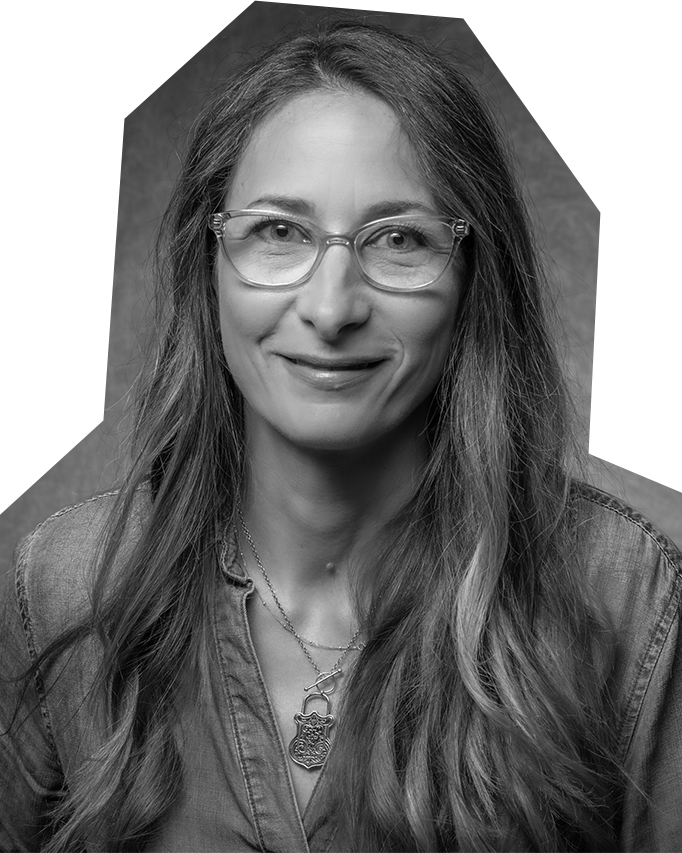 Black and white photo of Tiia Lager, a white woman with long hair and glasses.