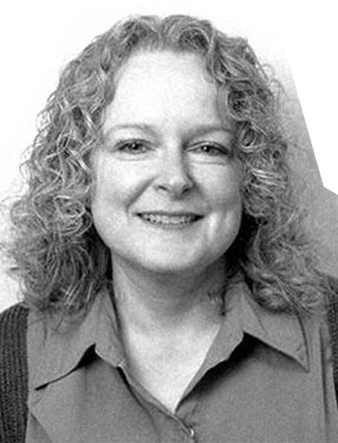 Black and white photo of Tina Shackleford, a white woman with curly blonde hair.