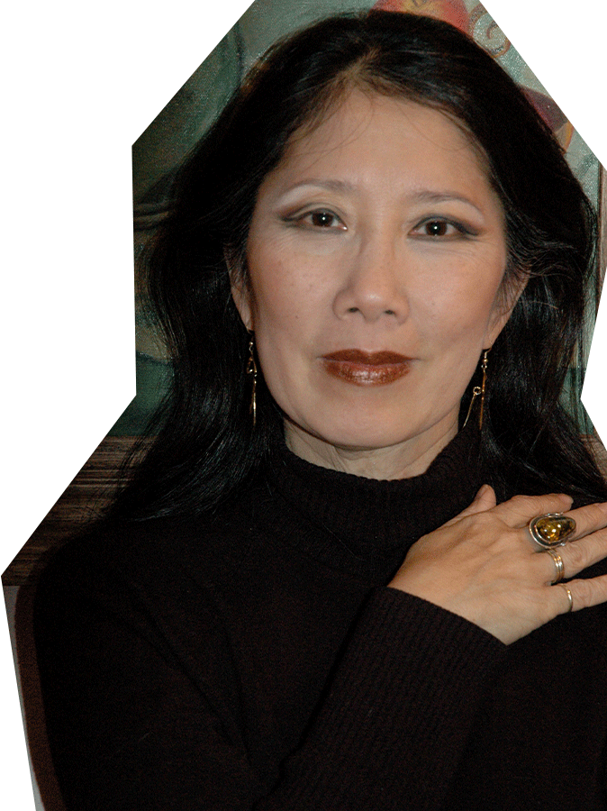 Photo of Susan Tsu, an Asian woman with medium length black hair, wearing a black blouse.