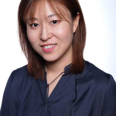 Photo of Vivienne Liu, an Asian woman with medium length brown hair, wearing a black blouse.