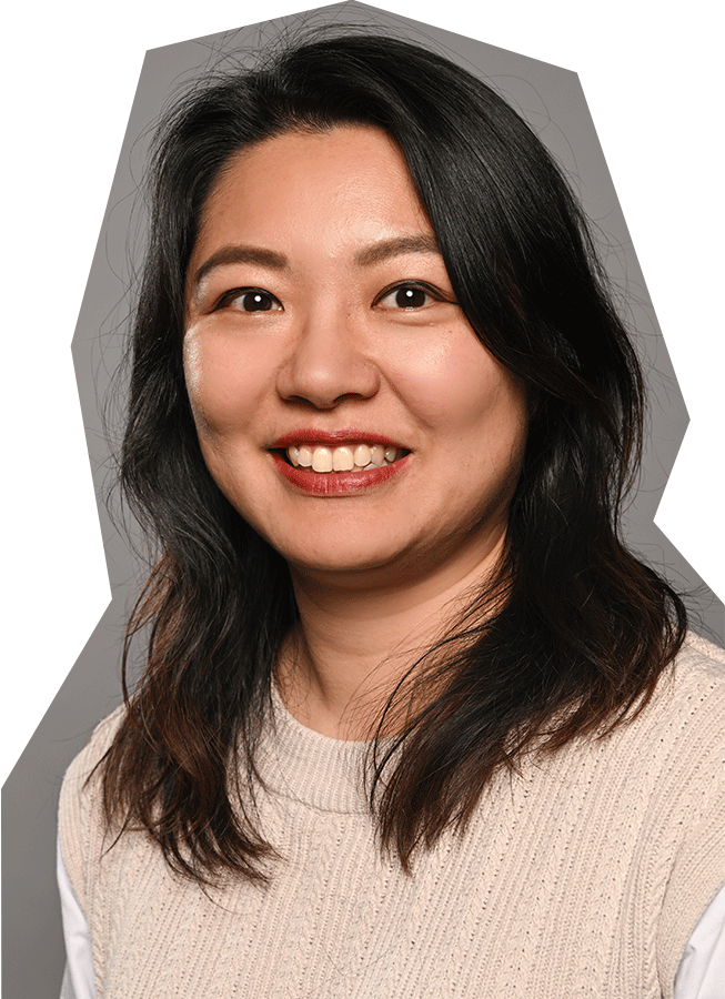 Photo of Miso Wei, an Asian woman with medium length dark hair, wearing a cream colored sweater, smiling.