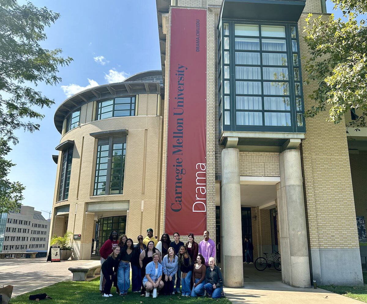 Group of students pose outside the Purnell Center for the Arts