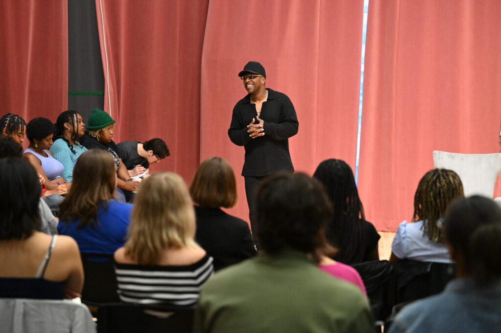 Leslie Odom, Jr. addresses a large group of students in an acting studio at Carnegie Mellon University.